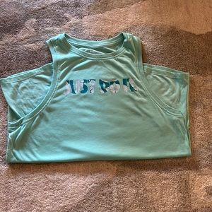 Teal Just Do it Nike Womens tank top in a print with plants on it.